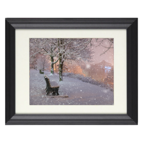 Snow falling on river road-frame